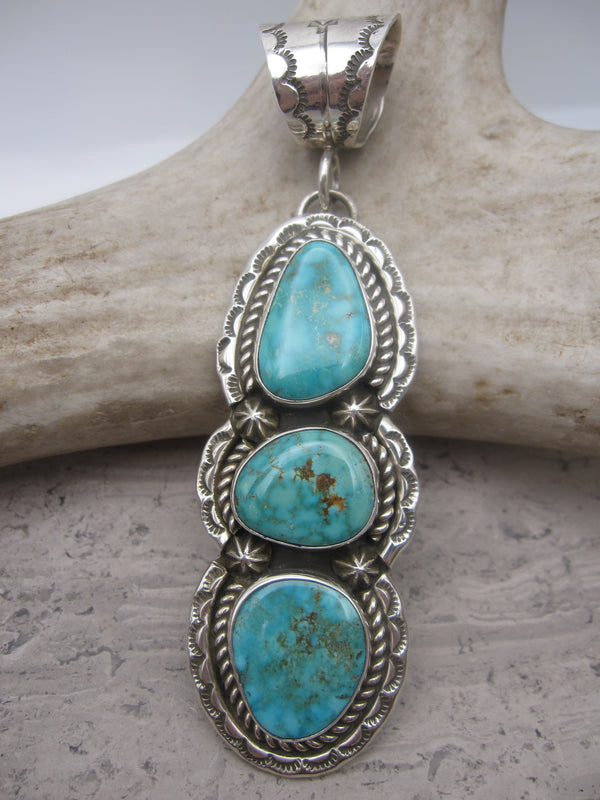 Native American shops Turquoise and Silver Pendant. Stamped T B